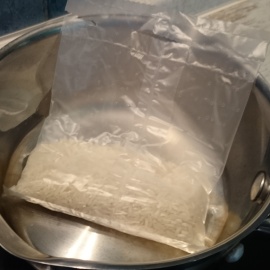 a bag of rice in a saucepan