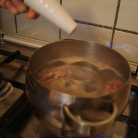 Cook pork tongue in a saucepan