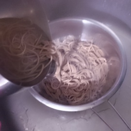 boiled noodles in a colander