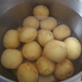 Potatoes are cooked in their uniform